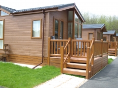 Holiday home decking golden oak & cedar holiday home decking steps park estate lodge installers suppliers manufacturers sundecks vinyl plastic skirting deck board pvc upvc extrusion polymer composite wpc wood free galvanised steel sub-frame
