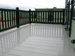 Holiday home decking beige deck board holiday home decking steps park estate lodge installers suppliers manufacturers sundecks vinyl plastic skirting deck board pvc upvc extrusion polymer composite wpc wood free galvanised steel sub-frame