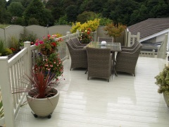 Beige-UPVC-home-garden-decking-deck-installation-seating-area